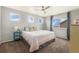 Bedroom featuring ample natural light, blue patterned curtains, and neutral walls at 7877 E 139Th Pl, Brighton, CO 80602