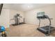 Bright home exercise room featuring carpet flooring and modern workout equipment at 7877 E 139Th Pl, Brighton, CO 80602