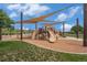 Community playground featuring slides and climbing structures under a sun-shade at 7877 E 139Th Pl, Brighton, CO 80602