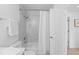 Bathroom featuring a marble shower, tub, and white tiled floors at 1818 S Quebec Way # 2-3, Denver, CO 80231