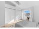 Bedroom with vaulted ceiling featuring natural light, closet and light hardwood flooring at 1818 S Quebec Way # 2-3, Denver, CO 80231