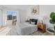 Bedroom featuring neutral colors, a large window, and stylish decor at 1818 S Quebec Way # 2-3, Denver, CO 80231