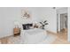 Bright bedroom featuring neutral tones, modern decor, and light wood floors at 1818 S Quebec Way # 2-3, Denver, CO 80231