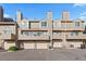 Exterior of townhome featuring attached garages and balconies at 1818 S Quebec Way # 2-3, Denver, CO 80231