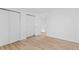 Open hallway featuring neutral walls, light wood floors, and access to other rooms at 1818 S Quebec Way # 2-3, Denver, CO 80231