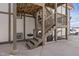 This unit has basement access from the back, with an exterior staircase to the above unit at 2700 S Holly St # 100, Denver, CO 80222