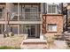 This home has an exterior door to the basement, a patio, and a wooden staircase at 2700 S Holly St # 100, Denver, CO 80222