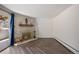 Cozy living room, fireplace, and herringbone floors, complemented by a sliding glass door at 2700 S Holly St # 100, Denver, CO 80222