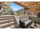 This cozy patio includes an outdoor seating area, garden, and wood ceiling at 2700 S Holly St # 100, Denver, CO 80222
