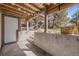 This cozy patio includes an outdoor seating area, garden, and wood ceiling at 2700 S Holly St # 100, Denver, CO 80222