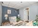 Cozy basement room featuring couch, coffee table, and neutral decor at 8304 S Upham Way, Littleton, CO 80128