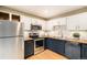 Kitchen with butcher block counters, stainless appliances, and ample cabinet space at 8304 S Upham Way, Littleton, CO 80128
