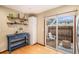 Eat-in kitchen features sliding door access to a private outdoor patio at 8304 S Upham Way, Littleton, CO 80128