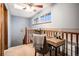Comfortable home office space featuring natural light and a cozy chair at 8304 S Upham Way, Littleton, CO 80128