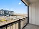 Balcony view of building construction, new townhomes and a black metal railing at 14412 Pansy Loop, Morrison, CO 80465