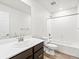 Bright bathroom featuring a single sink vanity with a white countertop and wood-look flooring at 14412 Pansy Loop, Morrison, CO 80465