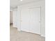 Bedroom with sliding closet doors, neutral carpet, and white trim at 14412 Pansy Loop, Morrison, CO 80465