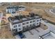 Modern townhome featuring a three-car garage and multiple stories of living space and exterior rooftop space at 14412 Pansy Loop, Morrison, CO 80465