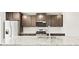 Modern kitchen featuring granite countertops, stainless steel appliances, and ample cabinet space at 14412 Pansy Loop, Morrison, CO 80465