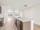 Bright kitchen featuring an island with granite countertops and stainless steel appliances at 14412 Pansy Loop, Morrison, CO 80465