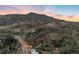 An aerial view of Red Rocks Amphitheater, surrounded by the setting sun at 14412 Pansy Loop, Morrison, CO 80465