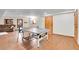 Basement with ping pong table, wood flooring, and a walkout door to the exterior at 30382 Marys Dr, Conifer, CO 80433