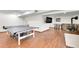 Basement rec room with ping pong table, foosball, and a stone fireplace at 30382 Marys Dr, Conifer, CO 80433