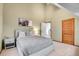 Bedroom featuring a vaulted ceiling, carpeted floor, and neutral decor at 30382 Marys Dr, Conifer, CO 80433