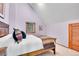 Bedroom featuring a colorful quilt, wood-framed bed, and a single window at 30382 Marys Dr, Conifer, CO 80433