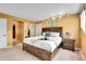 Spacious bedroom with carpet and an open view to another bedroom or closet at 30382 Marys Dr, Conifer, CO 80433