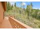 Deck that overlooks a wooded area at 30382 Marys Dr, Conifer, CO 80433