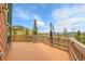 Exterior deck boasts wood flooring, a railing, a clothesline and views of the mountains and trees at 30382 Marys Dr, Conifer, CO 80433