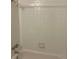Clean and tiled bathroom with a shower-tub combination at 5543 Victor St, Denver, CO 80239