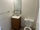 Bathroom featuring a vanity, mirror, updated fixtures, and toilet at 5543 Victor St, Denver, CO 80239