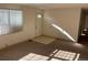 Bright and airy living room with carpet and a front door, ready for personal touches at 5543 Victor St, Denver, CO 80239