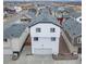 Aerial view of house showing driveway, garage, and surrounding homes at 46542 Avery Ln, Bennett, CO 80102