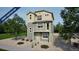 Two-story home showcasing a charming balcony, neutral color palette, and well-maintained gravel landscaping at 46542 Avery Ln, Bennett, CO 80102