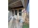 Outdoor area featuring a porch and siding, with some yard views and exterior features at 7170 W Mississippi W Ave, Lakewood, CO 80226