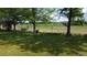 View of the fenced backyard backing to a park and track; perfect for those who appreciate nature and outdoor activities at 7170 W Mississippi W Ave, Lakewood, CO 80226