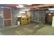A partially finished basement featuring open ceilings, a workbench, and ample storage space; perfect for workshop or storage needs at 7170 W Mississippi W Ave, Lakewood, CO 80226