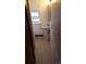 A small bathroom featuring a classic pedestal sink, window, and tiled floor; a functional space with vintage charm at 7170 W Mississippi W Ave, Lakewood, CO 80226