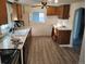 A quaint kitchen featuring white countertops and classic wooden cabinets; an inviting space to create culinary delights at 7170 W Mississippi W Ave, Lakewood, CO 80226