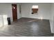 Newly renovated living room featuring wood floors, freshly painted white walls, and a contemporary aesthetic at 7170 W Mississippi W Ave, Lakewood, CO 80226