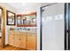 Bathroom featuring wooden cabinets, granite countertops, and a black framed shower at 2595 S Adams St, Denver, CO 80210
