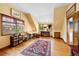 Bedroom featuring hardwood floors, light filled windows, and an oriental rug at 2595 S Adams St, Denver, CO 80210