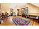 Bedroom featuring hardwood floors, light filled windows, and an oriental rug at 2595 S Adams St, Denver, CO 80210