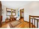 Upstairs hallway area with a bench, natural light, and wood trim at 2595 S Adams St, Denver, CO 80210