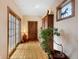 Bright hallway with hardwood floors, and decorative windows for natural light at 2595 S Adams St, Denver, CO 80210