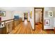 Second floor hallway featuring hardwood floors and natural light at 2595 S Adams St, Denver, CO 80210