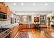 Charming kitchen boasts stainless steel appliances, granite countertops, and ample natural light from the window at 2595 S Adams St, Denver, CO 80210